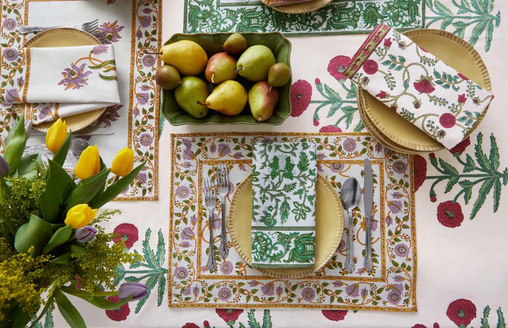 Holiday table setting with tablecloth, napkins and placemats